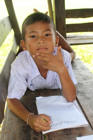 UDONTHANI, THAILAND â€“ SEPTEMBER 24, 2018:  Asian boy,  Asian student is writing,  be tests by...