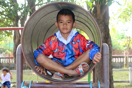 UDONTHANI, THAILAND â NOVEMBER 29, 2018:  Thai student,  he is playing in playground of BAN NONG WANG NON KHI LEK school,  he entirely enjoys and happy.のeditorial素材
