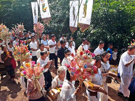 UDONTHANI, THAILAND â€“ NOVEMBER 9, 2019:  Thai people group is walking to go to a temple for...