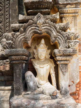 Ancient, Exterior details of the brick arrangement and carving wall. Angel Sculpture at the door. Bagan, Myanmar ( burma ).の写真素材