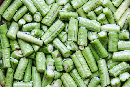 close up fresh green cow-pea slide on waterの写真素材