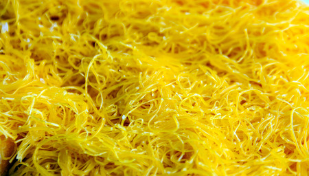 close up gold egg yolks thread dessert (fios de ovos) call foi thong in Thailandの写真素材