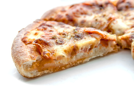 side view close up layer of peperoni pizza on isolate white backgroundの写真素材