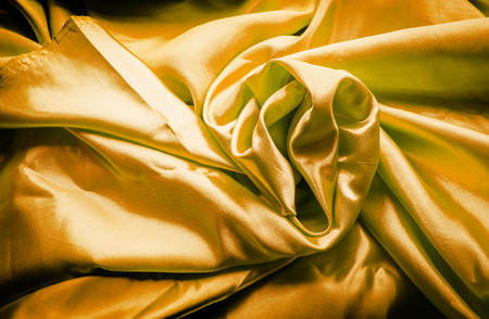 abstract gold yellow silk fabric texture for background