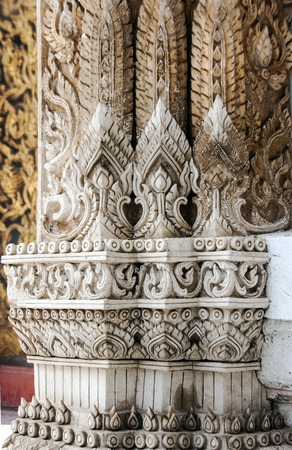 close up Thai pattern architecture detail in buddist temple  on gate frameの写真素材
