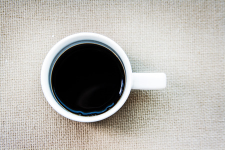 americano coffee on rattan in ceramic mugの写真素材