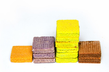 close up multi color layer wafer on side show stair step or graph on white backgroundの写真素材