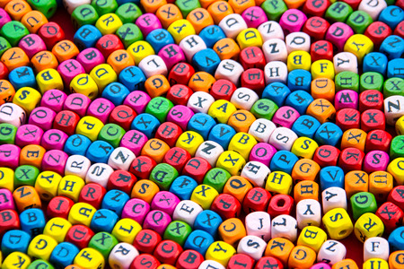 color Alphabet in wood cupe backgroundの写真素材