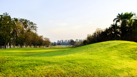 green filed for playing golf in clouding dayの写真素材