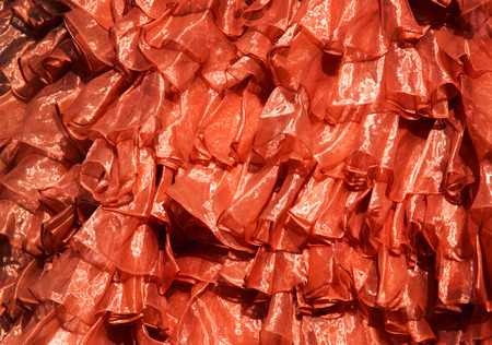 close up red satin textile texture for backgroundの写真素材