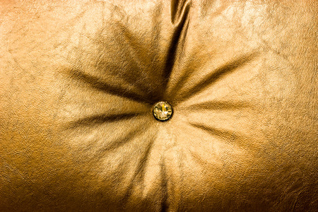 close up daimon on leather texture in gold conceptの写真素材