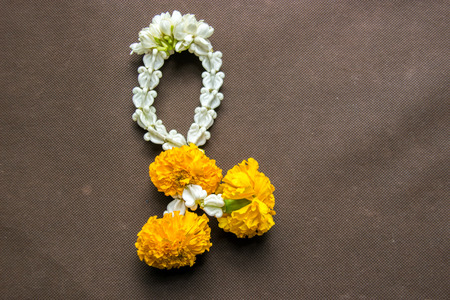 close up group of Jasmine and Yellow Marigold Garland flower for Pay homage to the Buddhaの写真素材