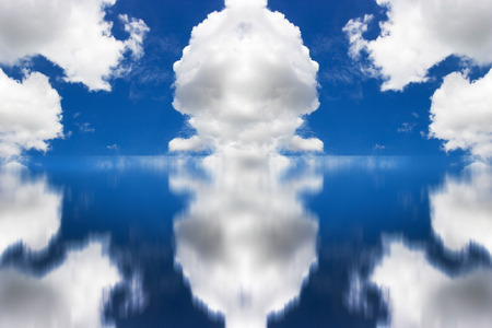 cloudy sky reflexing on water before raining panoramaの写真素材