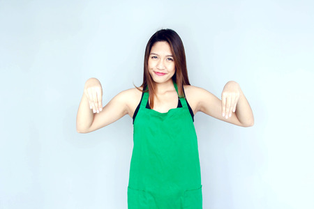 asian girl action with green apron suite on clear backgroundの写真素材