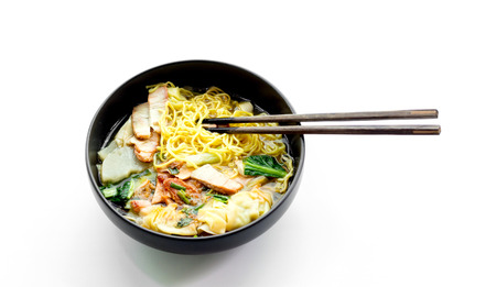 shopstick inside to eat red pork noodle on whiteの写真素材