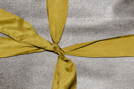 close up gold ribbon on present box in classic