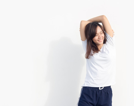close up asian Thai girl exercise in sport suite on white background