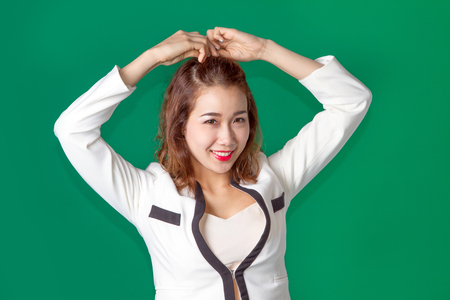 close up asian thai lady in business wear on green screen and smileの写真素材