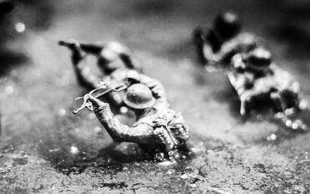 abstract blur soldier toy in situation war on forest concept in black and white grainの写真素材