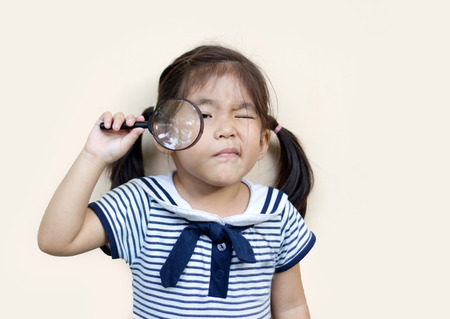 asian girl use menifiger to search something in blur background playparkの写真素材