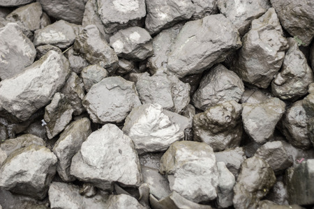 wet stone with mud in asian river when water tide for background