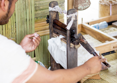 select focus cotton made fabric process  with putching tool from wood in agriculture rural life of...