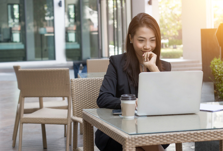 entrepreneur businesswoman asian lady busy day with laptop in outdoor place backgroundの写真素材