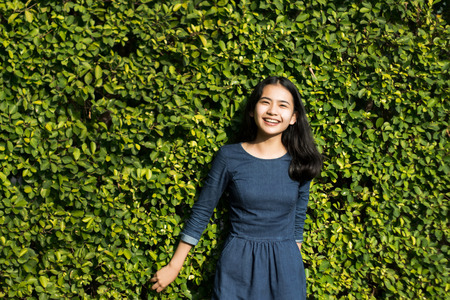 asian girl cute smile face on green park backgroundの写真素材