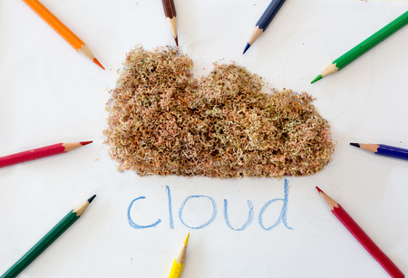 color pencils point to sawdust like cloud shape on white background in data collect conceptの写真素材