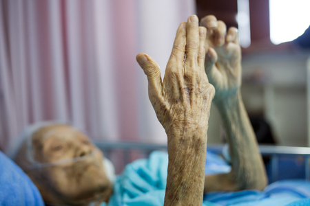 select focus hand of old grandmother to heal healthy the show aging skin and saving life in hospital roomの写真素材