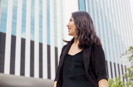 smart asian lady look forward to future front of high building urban life in woman leadr conceptの写真素材