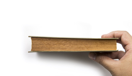 close up old paper texture side view with hand on white backgroundの写真素材