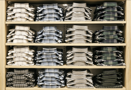 close up shirt on shelf store in wardrobe walk in clothesの写真素材