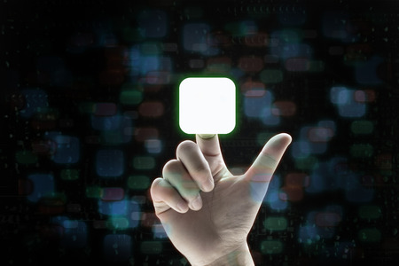 point finger choose application icon on dark bokeh backgroundの写真素材