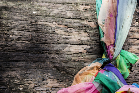 Color fabric hold old wet wood to protect angle in woodの写真素材