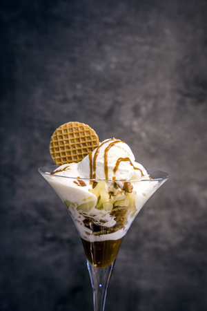 mixed ice cream with fruite and snack on dark backgroundの写真素材