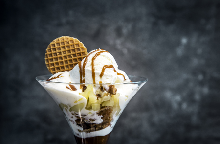 close up mixed ice cream with fruite and snack on dark backgroundの写真素材