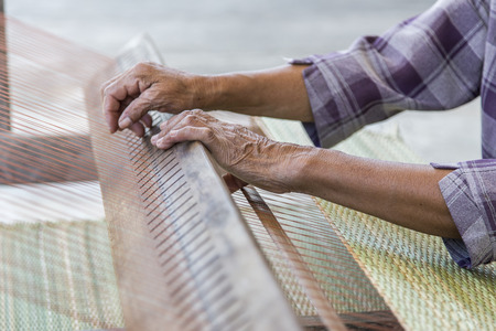 old hand  make handmade rattan from dry leaf and rope for backgroundの写真素材