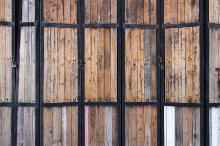 wood door with steel and lock backgroundの写真素材