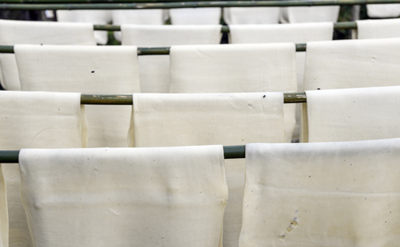 close up dry rubber with wood rack outdoor on fieldの写真素材