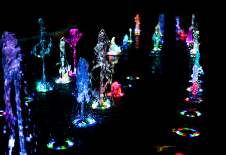 abstract art from fountain water with LED light in dark backgroundの写真素材