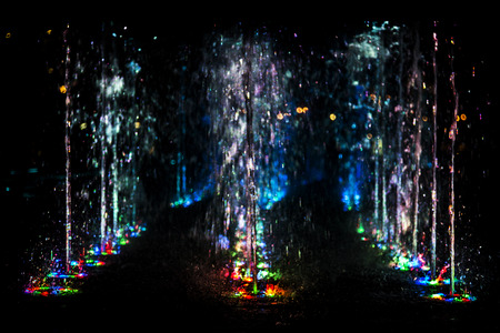 abstract art from fountain water with LED light in dark backgroundの写真素材