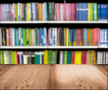 wood table top for display product with blur library backgroundの写真素材