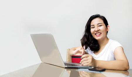 focus hand hold credit card to shopping online with notebookの写真素材