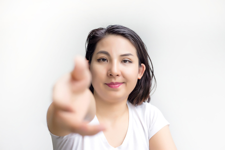 focus friendly face girl and give hand to chake for deal actionの写真素材