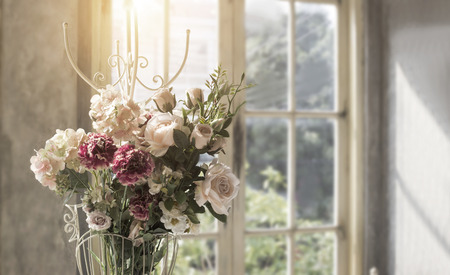 artificial flower with steel hanger on day light come from outside from window in summer summer season conceptの写真素材