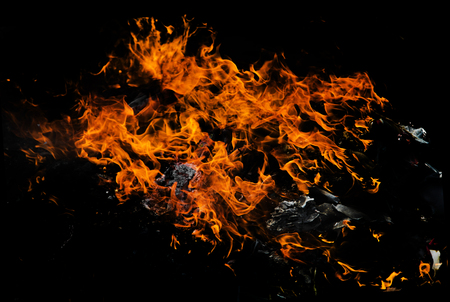 fire flame on black background. fire from burning paper and plastic polution in dark