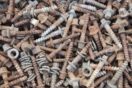 old rusty nail and screw retire from railway use for backgroundの写真素材