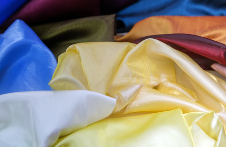colourful silk fabric texture for raw mate to make fashion dress. Grossy fabric in favric shop for backgroundの写真素材