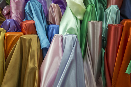 colourful fabric texture for raw mate to make fashion dress. Grossy fabric in favric shop for background の写真素材